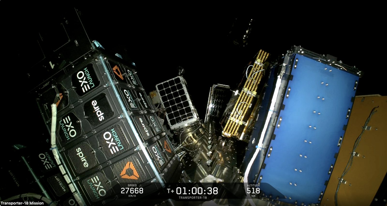 Satellites stacked on the Transporter-18 payload adapter in orbit, seen from the onboard camera at T+01:00:38, 518 km altitude